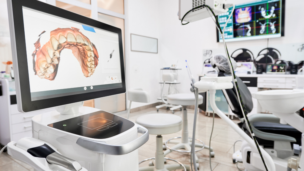 A modern dental office featuring a digital dental impression displayed on a computer screen