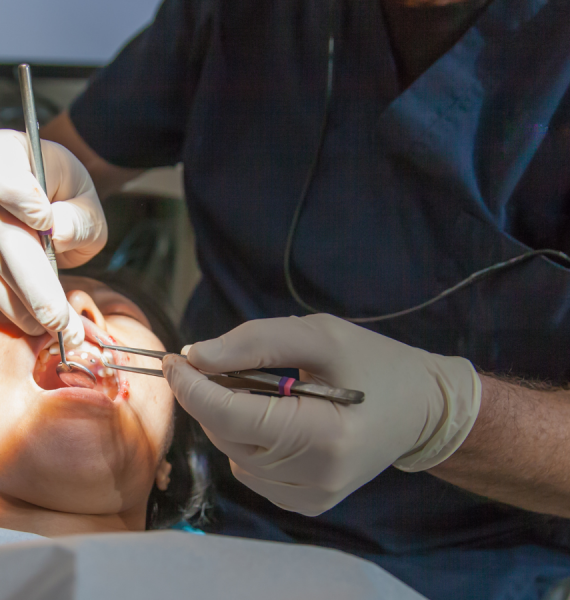 The image displays a patient undergoing a dental procedure, specifically an oral surgery